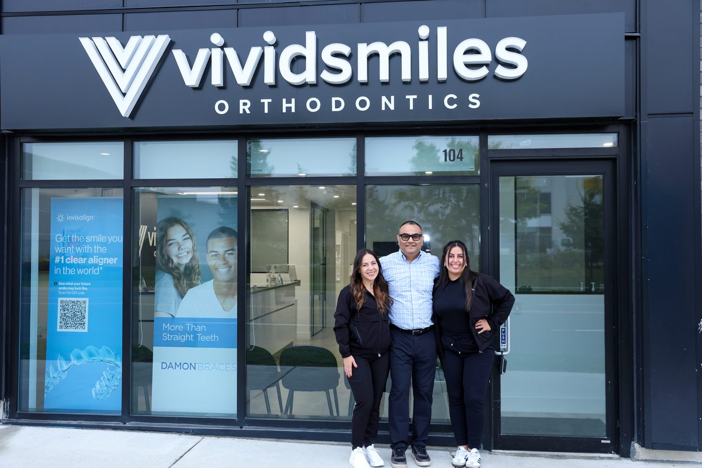 The Vivid Smiles team outside the clinic entrance